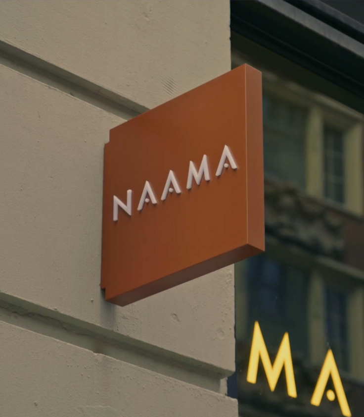 NAAMA studios sign